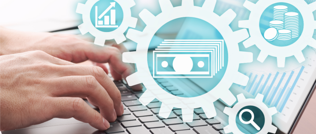Uma pessoa está mexendo no computador. Ela está controlando as operações da sua empresa. Em frente a tela aparecem diversos ícones: um gráfico, notas de dinheiro, moedas empilhadas e uma lupa.